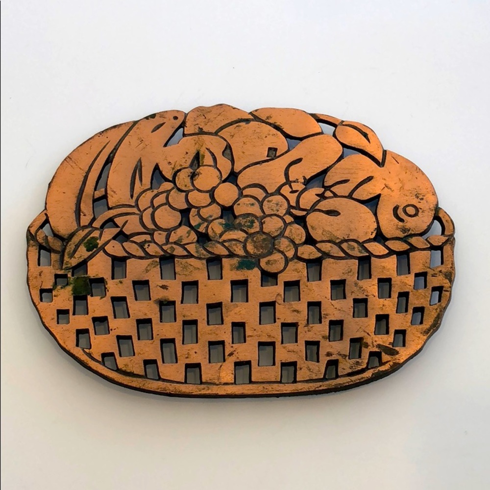 Vintage copper finished cast iron trivet